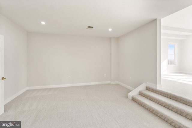 interior space featuring light colored carpet