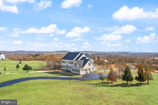 birds eye view of property with a mountain view