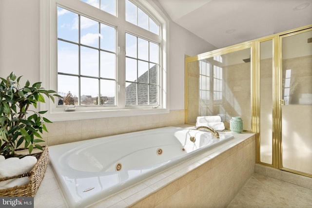 bathroom featuring tile patterned flooring and plus walk in shower