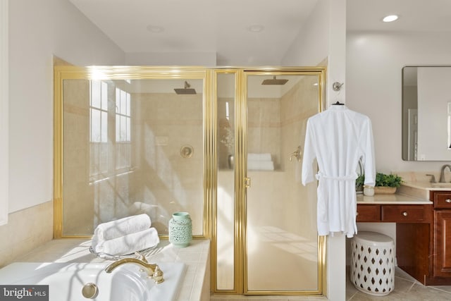 bathroom featuring tile patterned flooring, vanity, and separate shower and tub