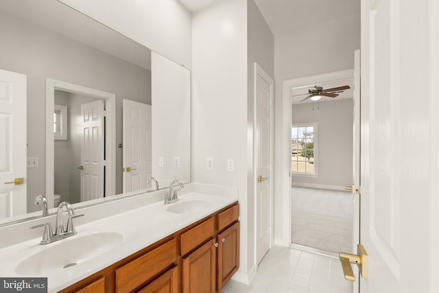 bathroom with vanity, tile patterned floors, ceiling fan, and toilet