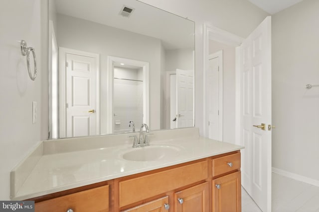 bathroom with walk in shower and vanity