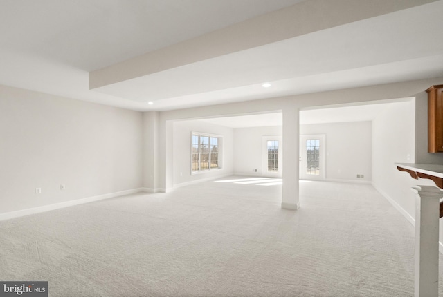 basement featuring light colored carpet