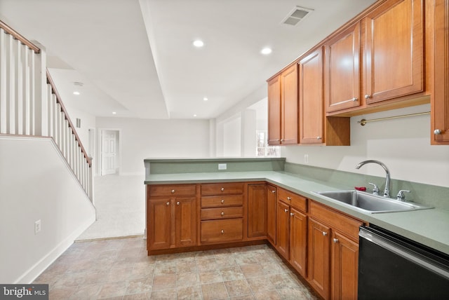 kitchen featuring sink, kitchen peninsula, and dishwasher