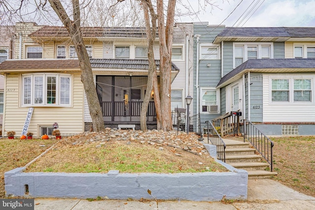 multi unit property featuring cooling unit and a sunroom