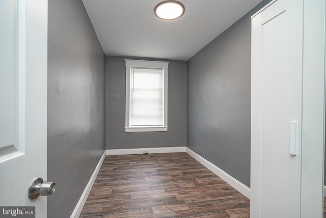 empty room featuring dark wood-type flooring