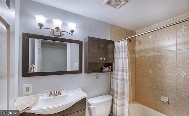 full bathroom with toilet, vanity, and shower / tub combo with curtain