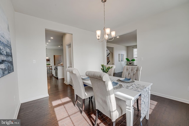 dining room with recessed lighting, wood finished floors, and baseboards