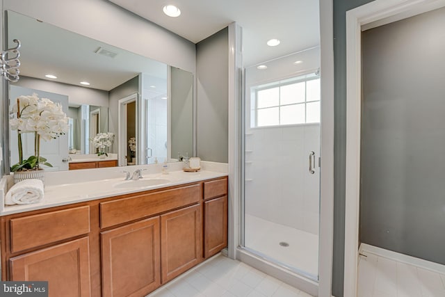 full bathroom featuring visible vents, recessed lighting, a stall shower, and vanity