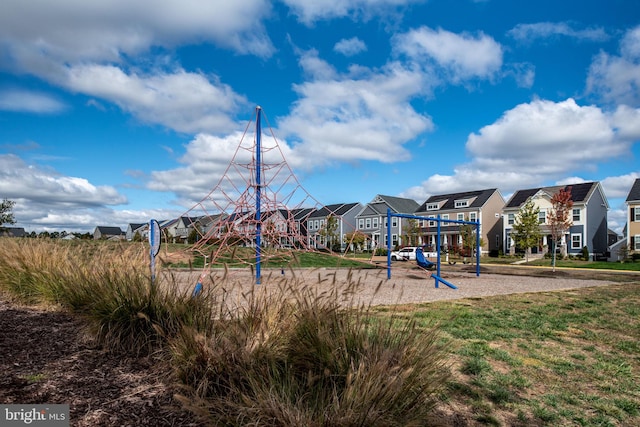 community jungle gym with a residential view