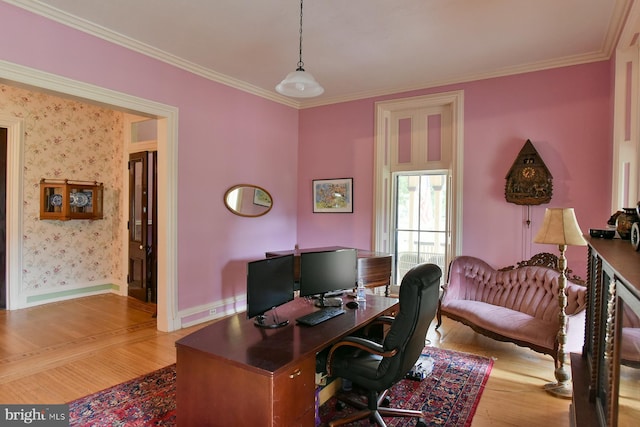 office with light wood-type flooring and ornamental molding