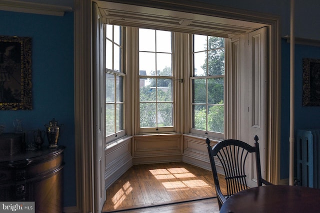 interior space with hardwood / wood-style floors and radiator