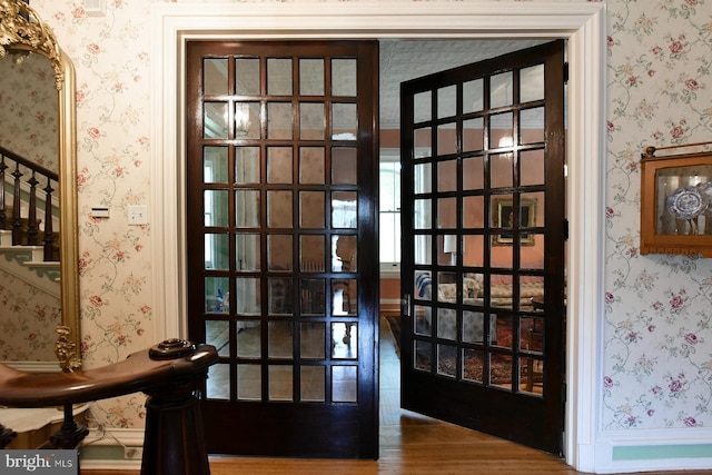 doorway to outside featuring french doors and hardwood / wood-style floors