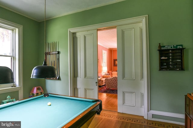 game room with crown molding, hardwood / wood-style flooring, and billiards