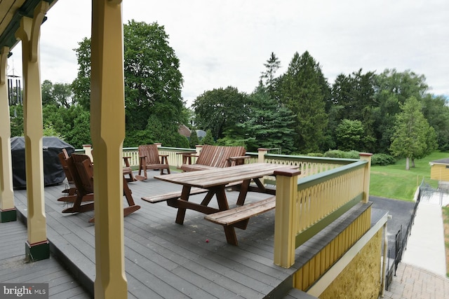 wooden terrace featuring area for grilling