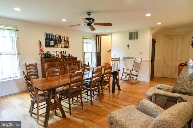 dining room featuring ceiling fan and light hardwood / wood-style flooring