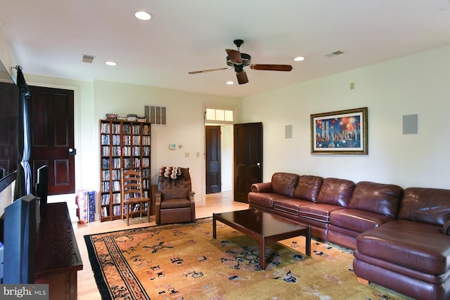 tiled living room featuring ceiling fan