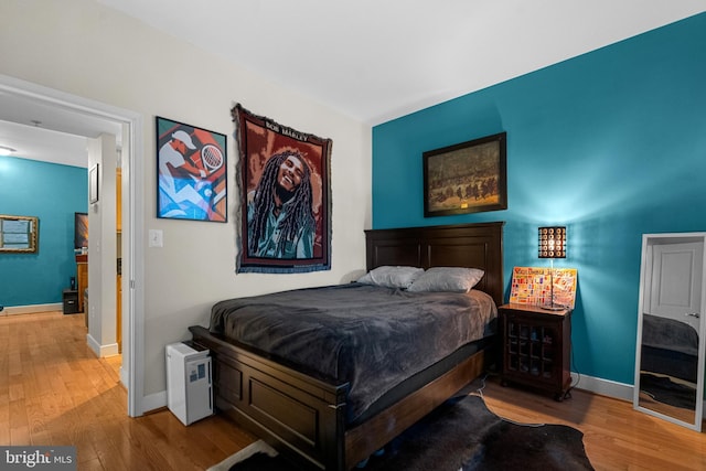 bedroom with light wood-type flooring