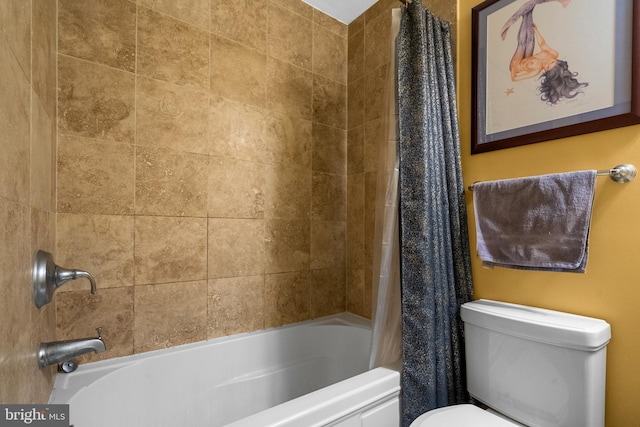 bathroom with shower / bathtub combination with curtain and toilet