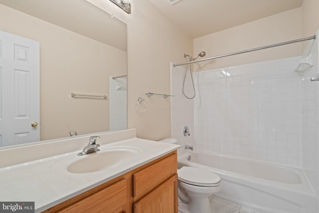 bathroom with toilet, bathtub / shower combination, and vanity