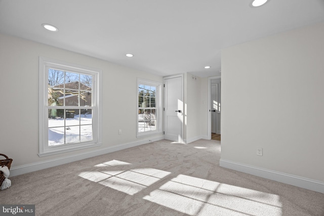 empty room featuring light colored carpet