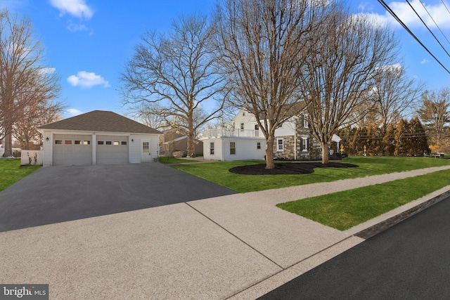 view of front of home with a garage and a front yard