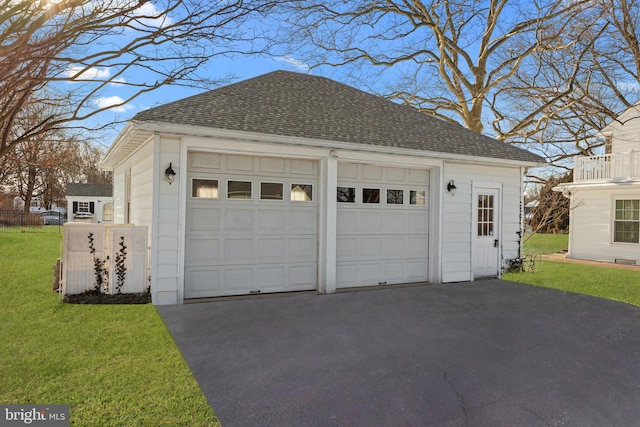 garage featuring a lawn