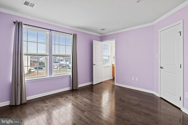 unfurnished bedroom with dark wood-type flooring, visible vents, and baseboards