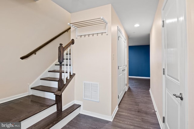 corridor featuring baseboards, visible vents, dark wood finished floors, stairway, and recessed lighting