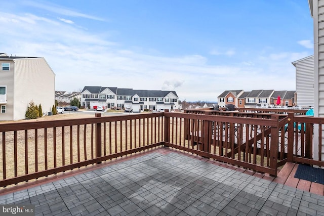 wooden terrace featuring a residential view