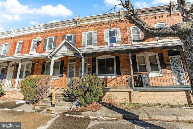 townhome / multi-family property with covered porch