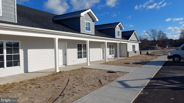 view of property exterior featuring a porch