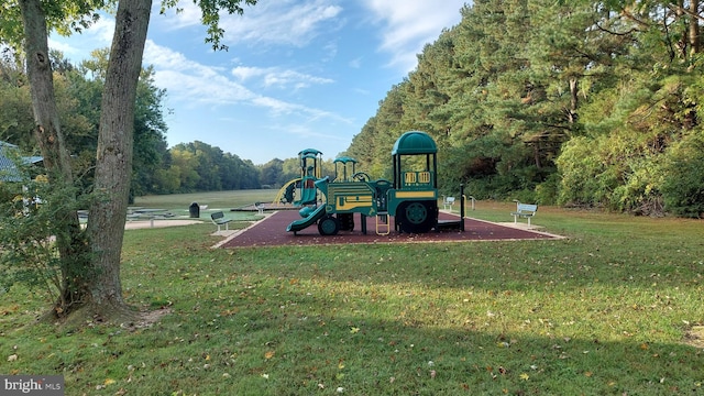 view of jungle gym with a lawn