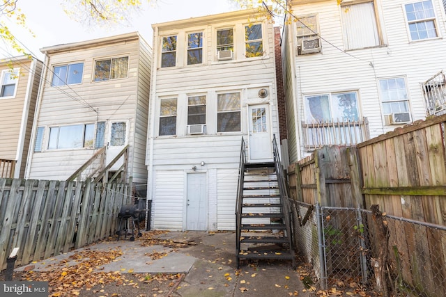 back of property featuring cooling unit