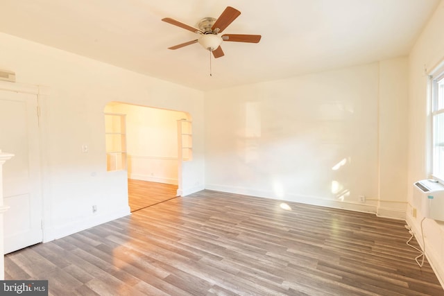 empty room featuring hardwood / wood-style flooring and ceiling fan