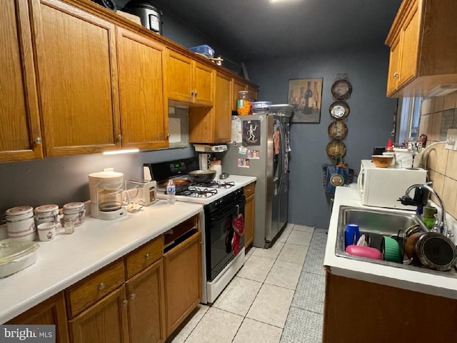 kitchen with sink, light tile patterned flooring, and white appliances