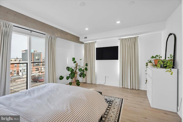 bedroom featuring access to outside and light hardwood / wood-style floors