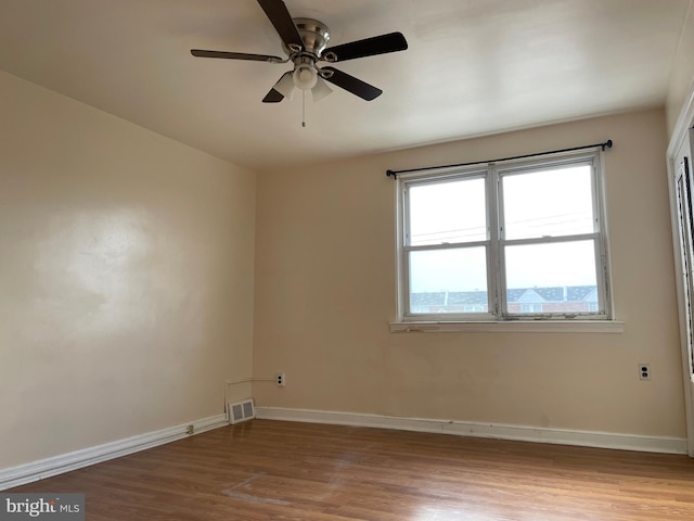 spare room featuring ceiling fan and light wood-type flooring