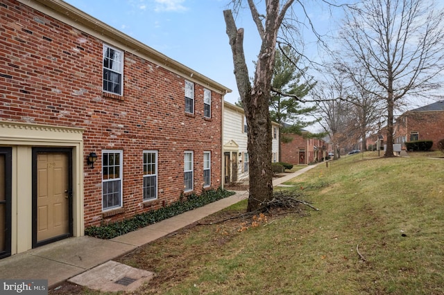 view of home's exterior with a lawn