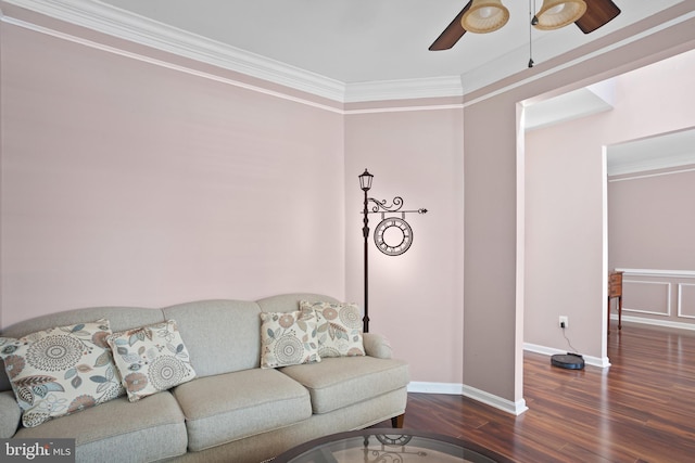 living room with ceiling fan, dark hardwood / wood-style flooring, and crown molding