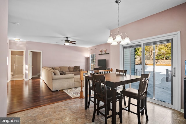 dining area featuring ceiling fan with notable chandelier and hardwood / wood-style flooring