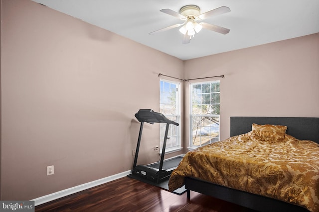 bedroom featuring ceiling fan and dark wood-type flooring