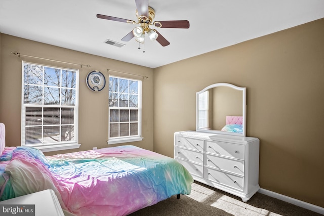 bedroom with ceiling fan and carpet