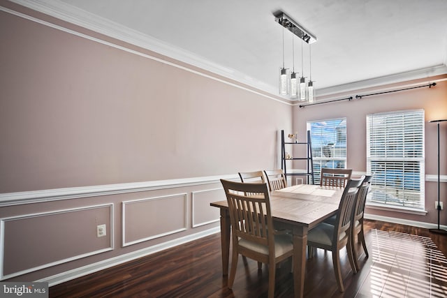 dining space with crown molding and dark hardwood / wood-style floors