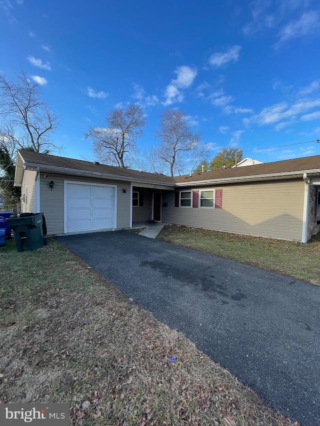 single story home with a garage