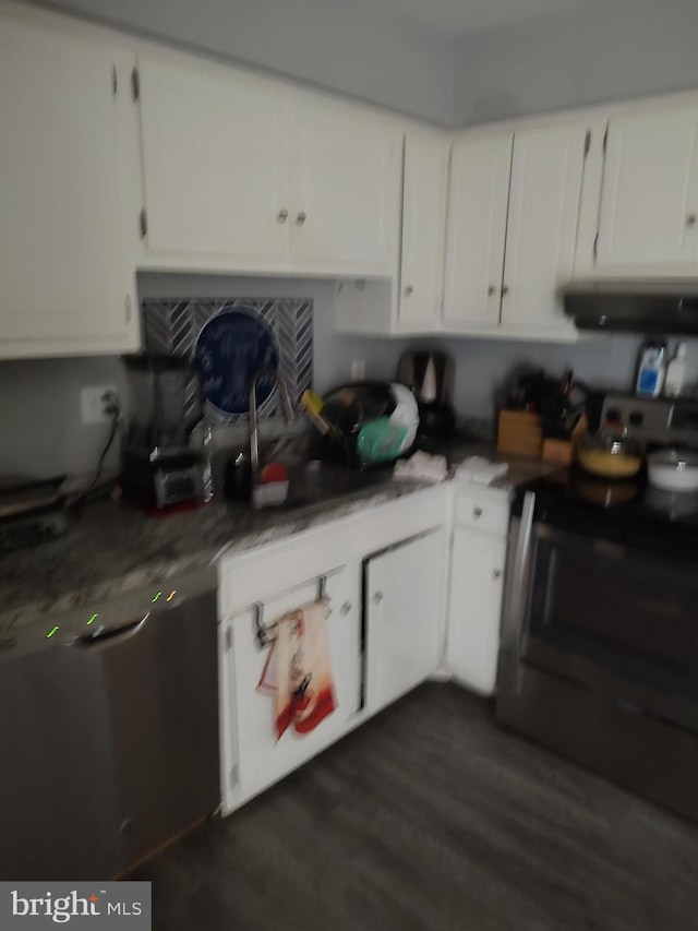 kitchen with electric stove, dark hardwood / wood-style flooring, white cabinets, and extractor fan