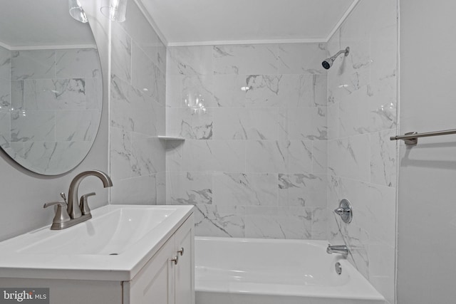 bathroom with vanity and tiled shower / bath