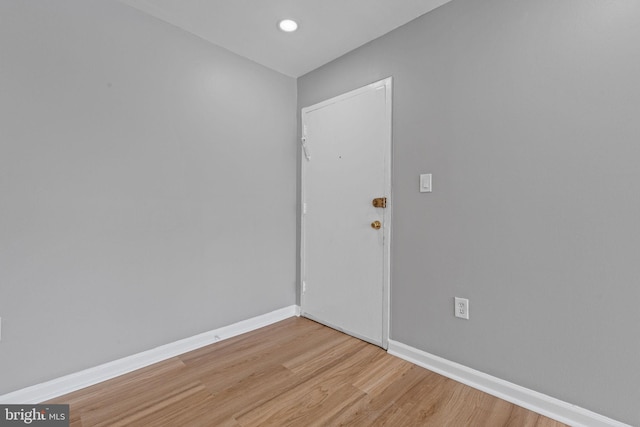 unfurnished room with light hardwood / wood-style flooring