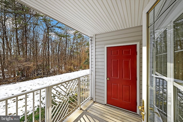 view of snow covered property entrance