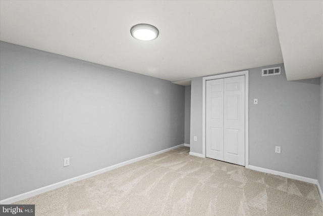 basement with light colored carpet